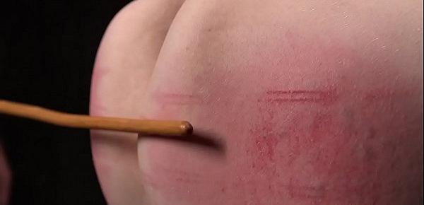  Pale redhead in metal device gets caned